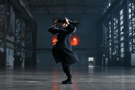 Man in Black Long Sleeve Dress Shirt and Black Hat