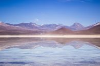 Brown and White Mountains Under Blue Sky