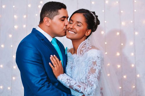 Free A joyful bride and groom embrace in a romantic wedding portrait. Stock Photo
