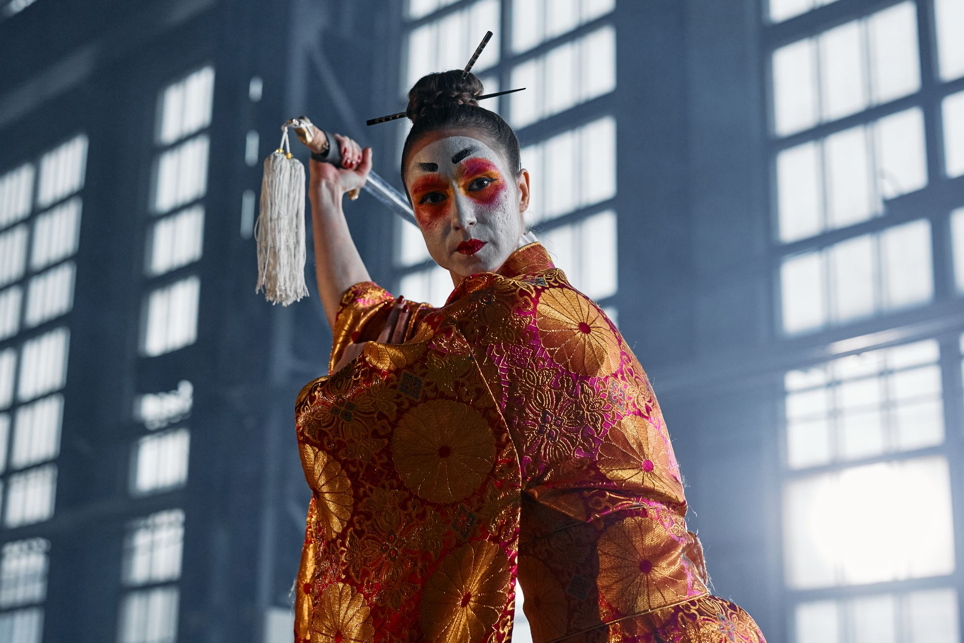 Woman in Kimono with Makeup Holding Sword