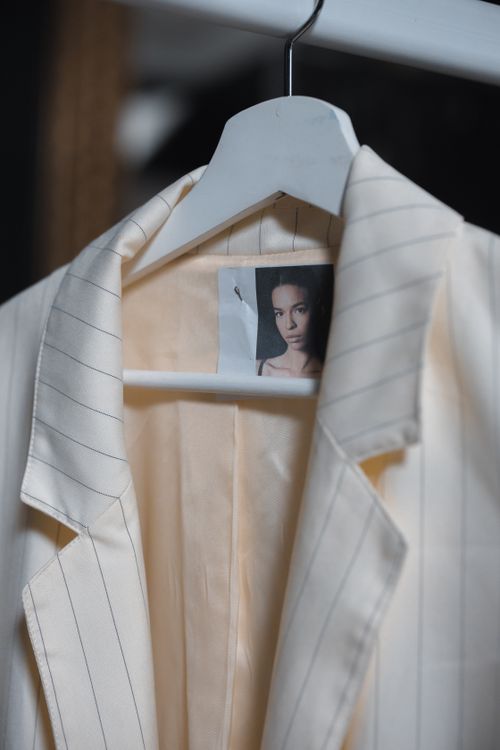 Close-up of a striped blazer on a clothes rail, photo by Ron Lach on Pexels