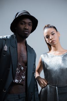 Portrait of a diverse couple in modern fashion with cool tones.
