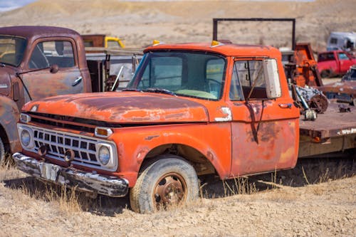 Free Vintage Trucks on the Dry Grassland Stock Photo