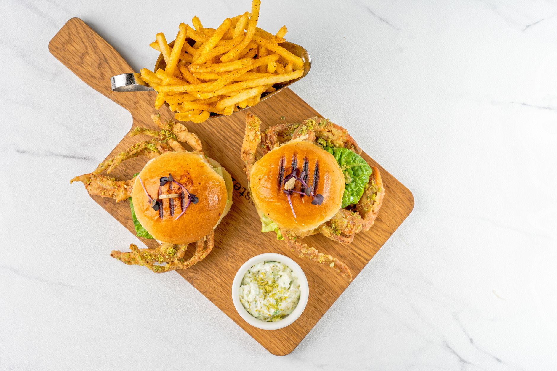 Crispy golden crab burger with tiger slaw on brioche bun