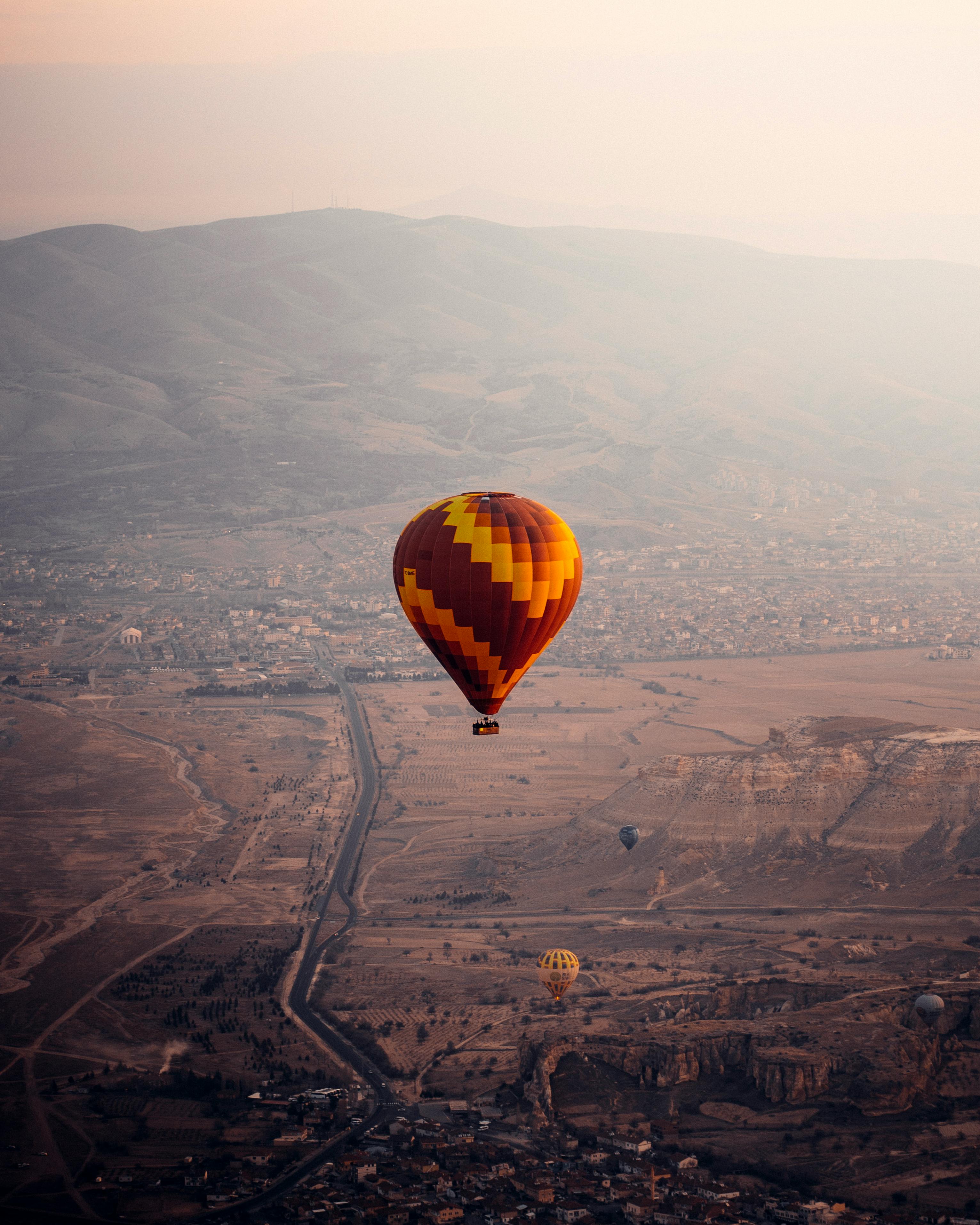 air balloon flying over city