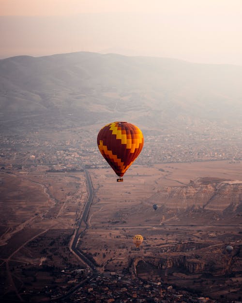 Air balloon flying over city