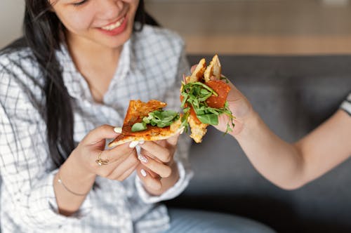 A Woman Eating a Pizza