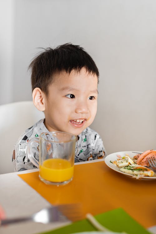 Photo of a Kid in Gray Shirt