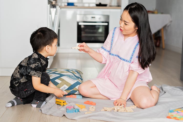 Woman Playing With A Boy 