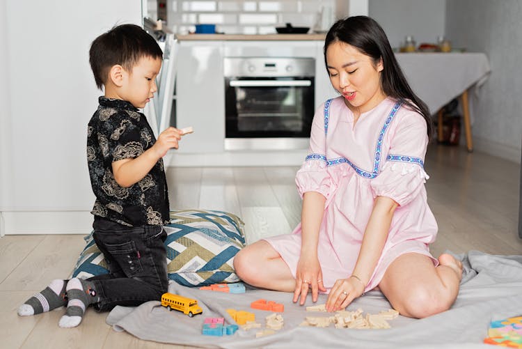 Mother Playing With Her Son 