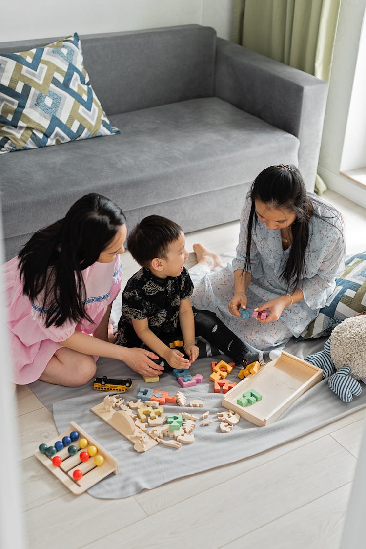 Parents Playing Block With Son