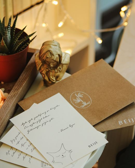 four handwritten letter cards on desk