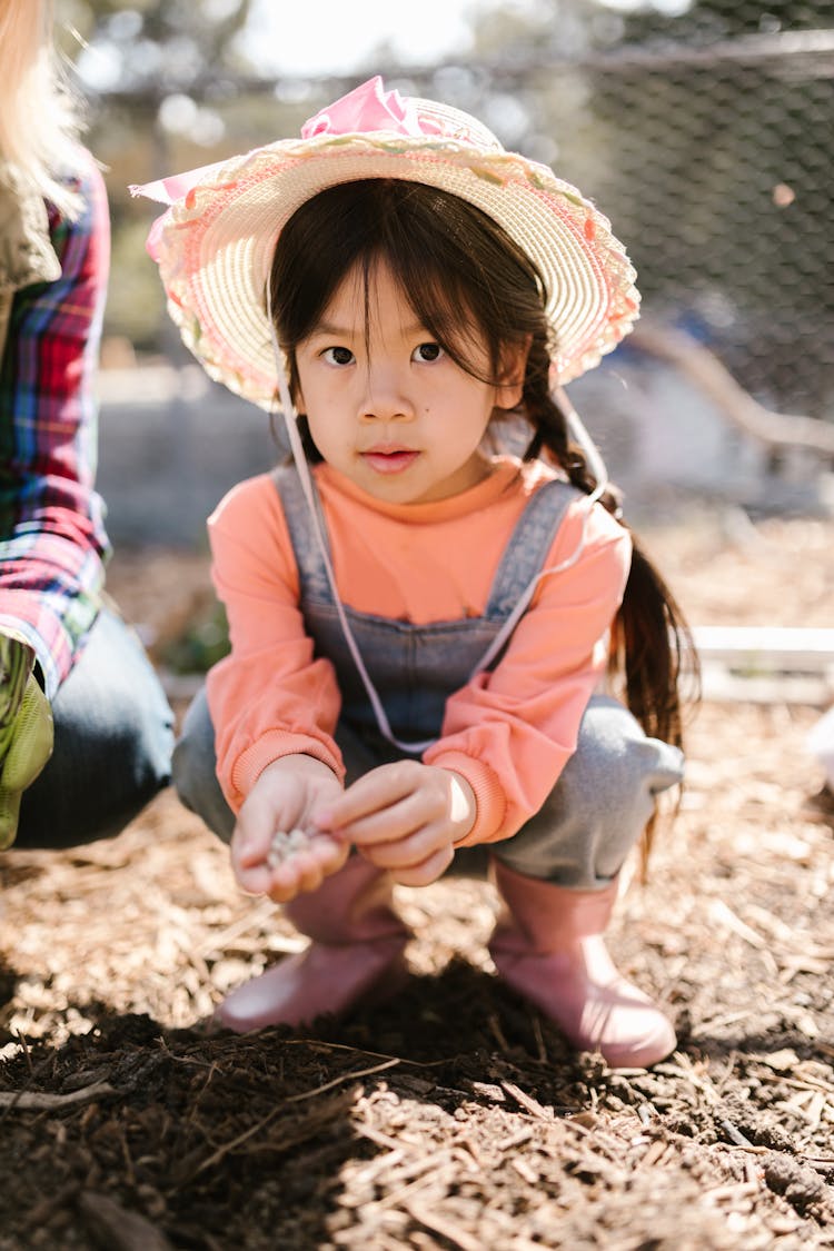 A Young Girls Enjoys Gardening