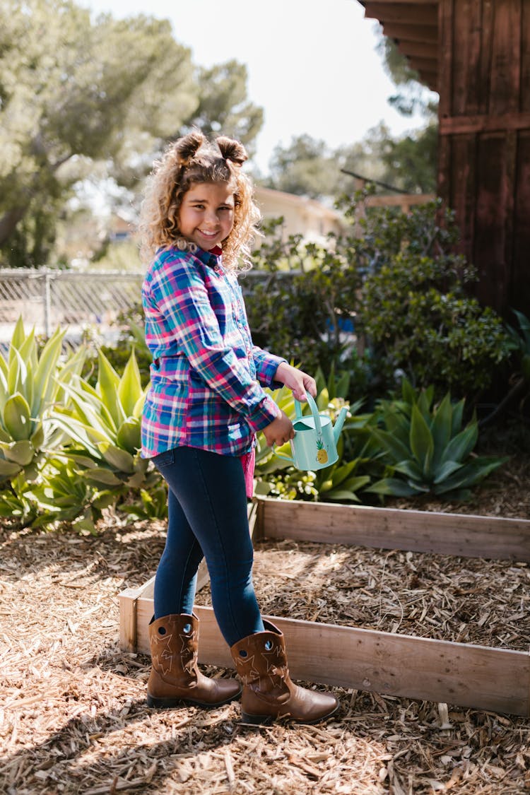 Girl Holding A Watering Can