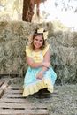 A Pretty Girl Wearing a Yellow and Blue Dress