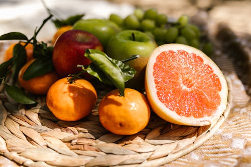 Close Up Shot of a Citrus Fruits and Apples 