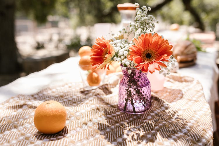 Elegant Flowers On A Purple Vase In Tilt Shift Lens 