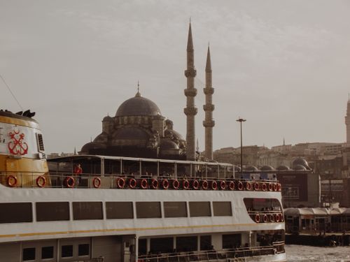 Free Istanbul skyline featuring a mosque and a passenger ship on the canal. Stock Photo