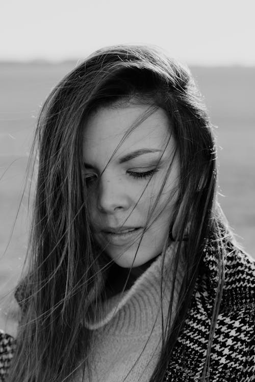 Free Grayscale Portrait of a Woman in a Sweater Stock Photo