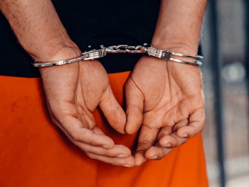 Free Close-Up Shot of a Person with Handcuffs Stock Photo