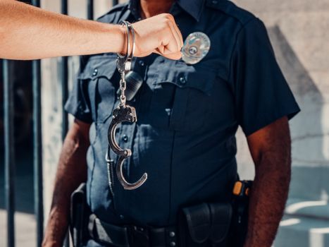 A person calmly exercising their right to remain silent during an arrest