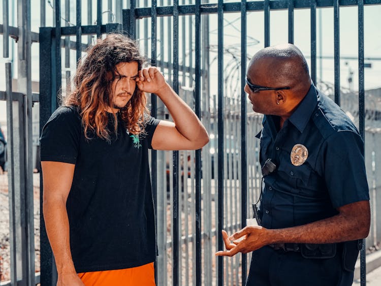 An Officer Talking To A Man