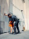 An Officer Frisking a Man