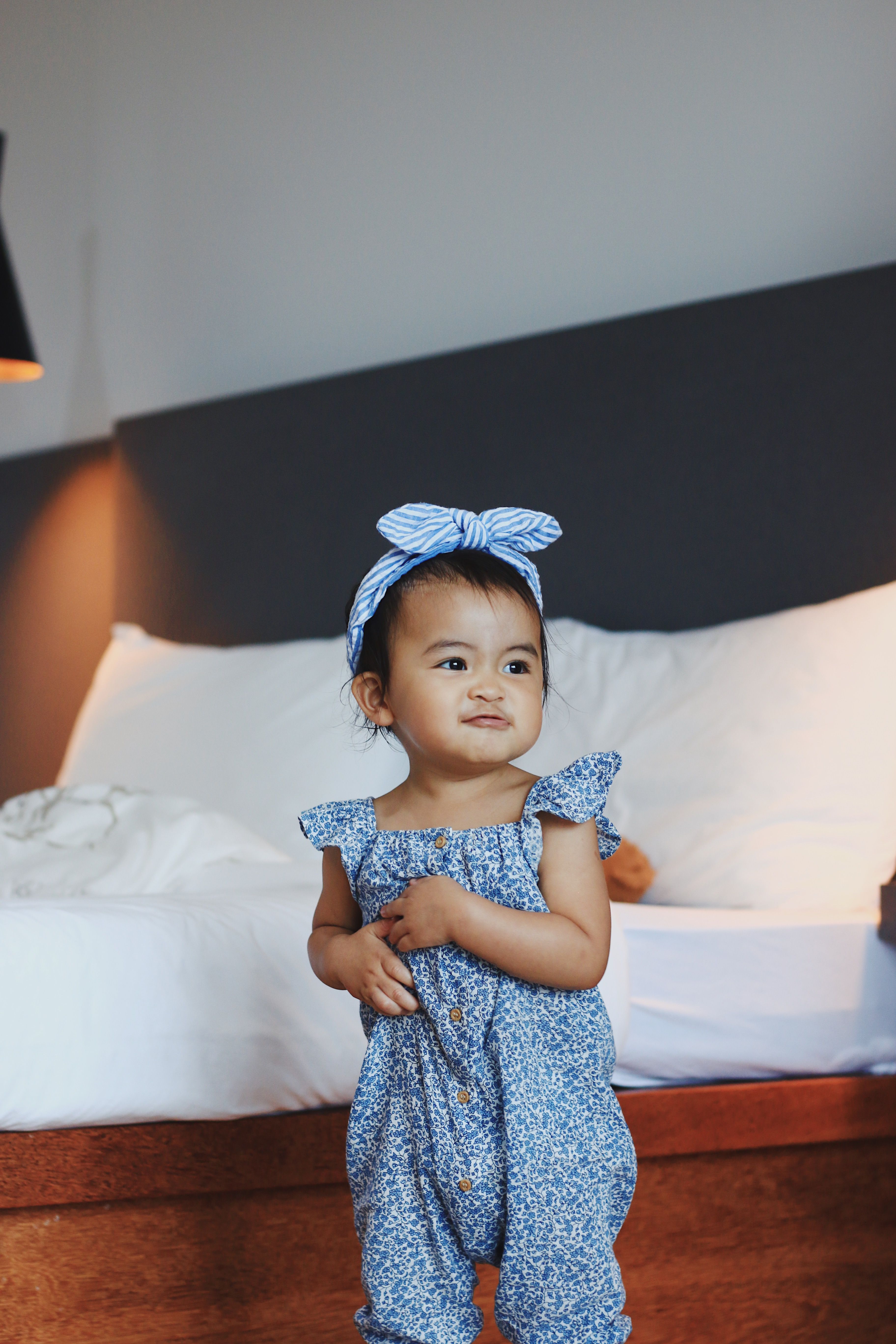 Portrait of a Cute Little Girl Wearing a Bow on Her Head · Free Stock Photo
