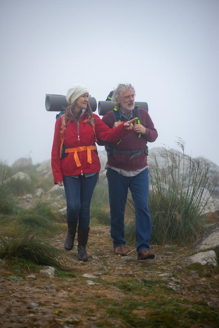 A Couple Walking On Mountain