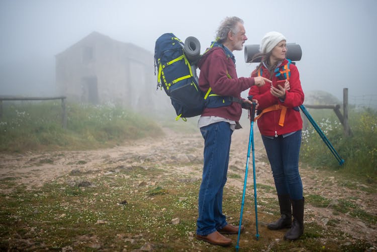 A Couple Holding Their Trekking Poles