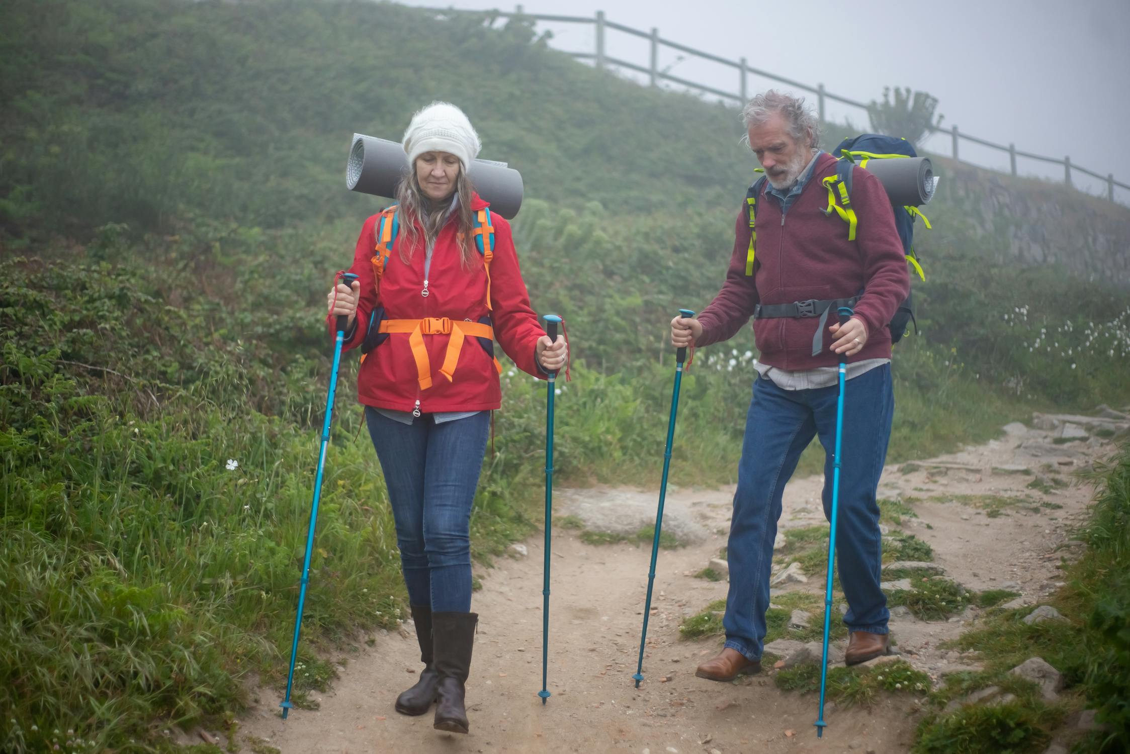 Two older folks hiking.