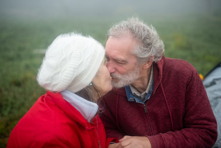 An Elderly Couple Kissing Each Other