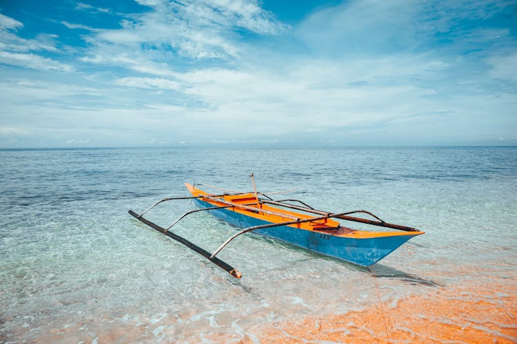 Colorful Boat In Clean Sea