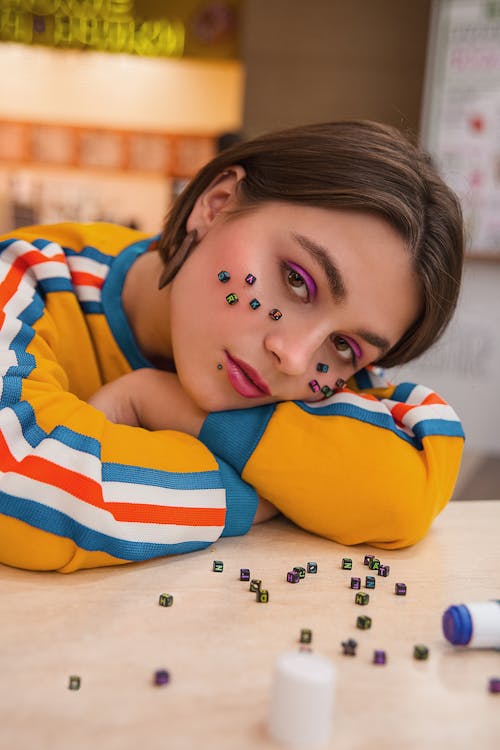 Free Young woman with beads on face Stock Photo