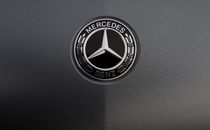 Logo of famous automobile concern on dark gray background