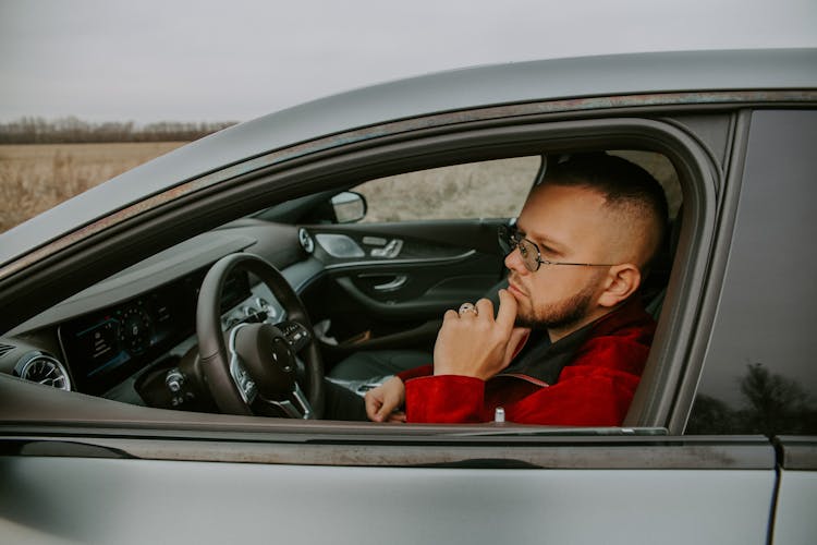 Stylish Man Sitting In Front Seat Of Car