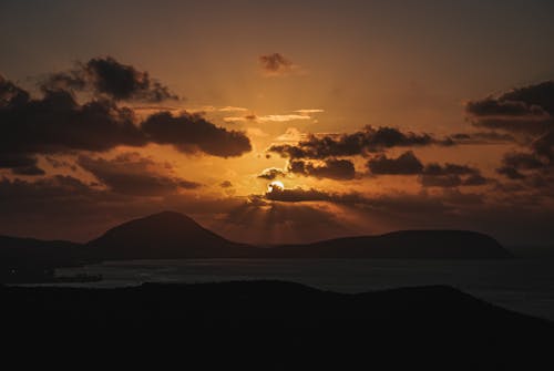 A Silhouette of Mountains during the Golden Hour