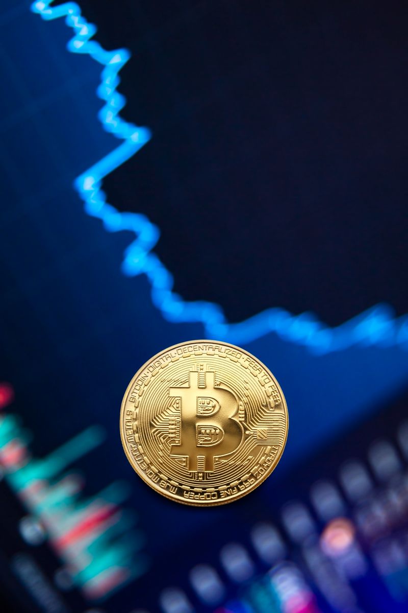 Gold Bitcoin coin against financial market chart representing crypto organic traffic and authority building