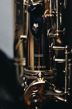 Detailed close-up of a golden saxophone showcasing intricate craftsmanship.