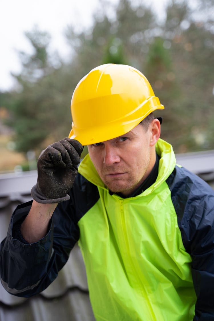 Portrait Of A Construction Worker Wearing A Yellow Helmet