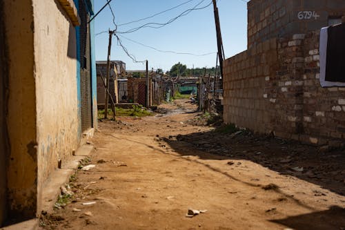 Dirt Road in Between Concrete Walls