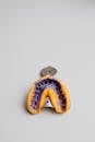 Top view of colourful dental alginate oral impression on impression tray for denture placed on white background