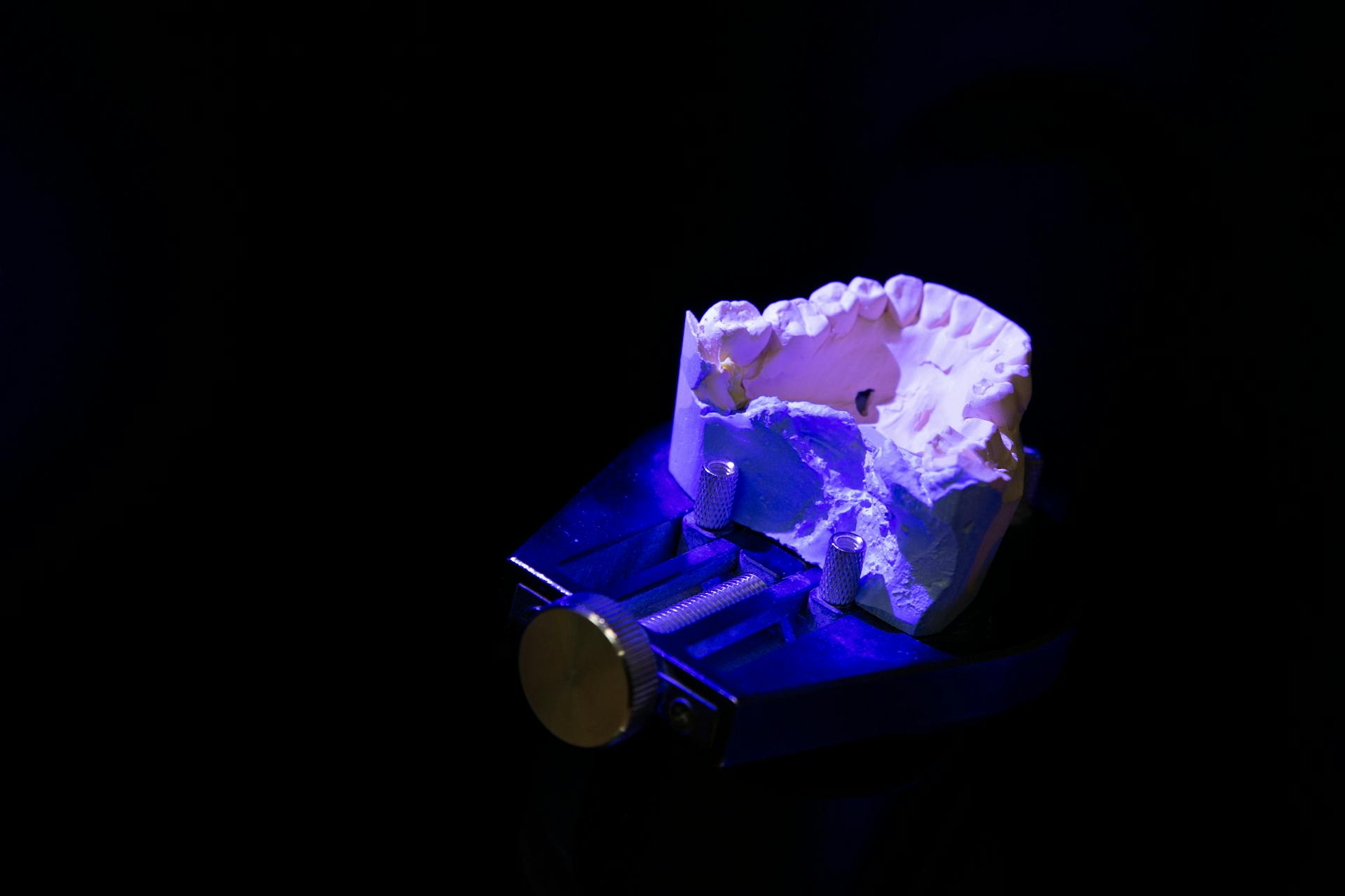 White dental impression under neon illumination