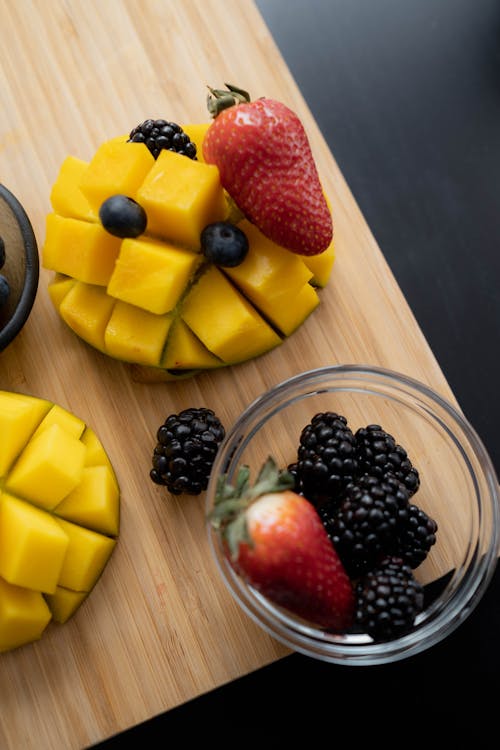 A Flatlay of Fruits on a Wooden Board