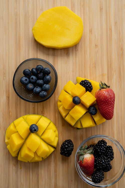 Sliced Fruit on Brown Wooden Surface