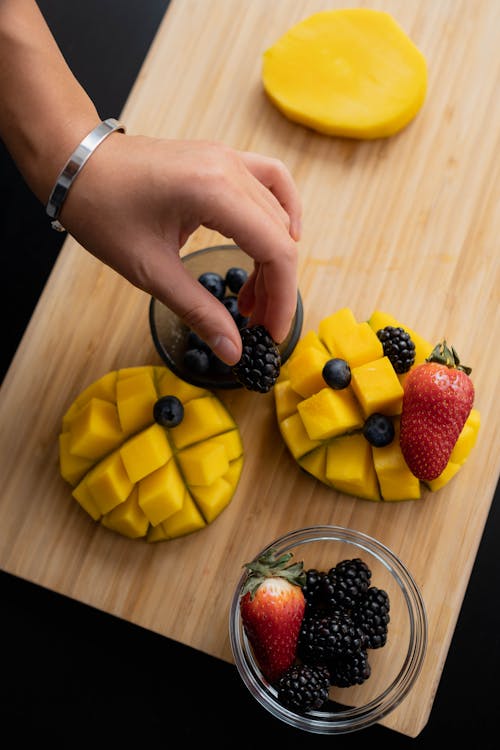 Free Sliced Mango with Berries on Top Stock Photo