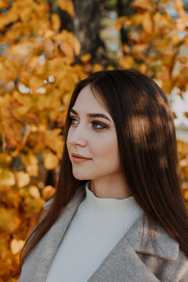 Woman in white turtleneck shirt outdoors