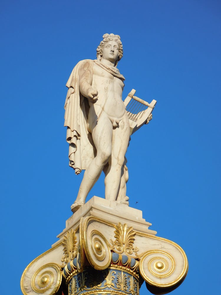 Statue Of Apollo Holding A Lyre
