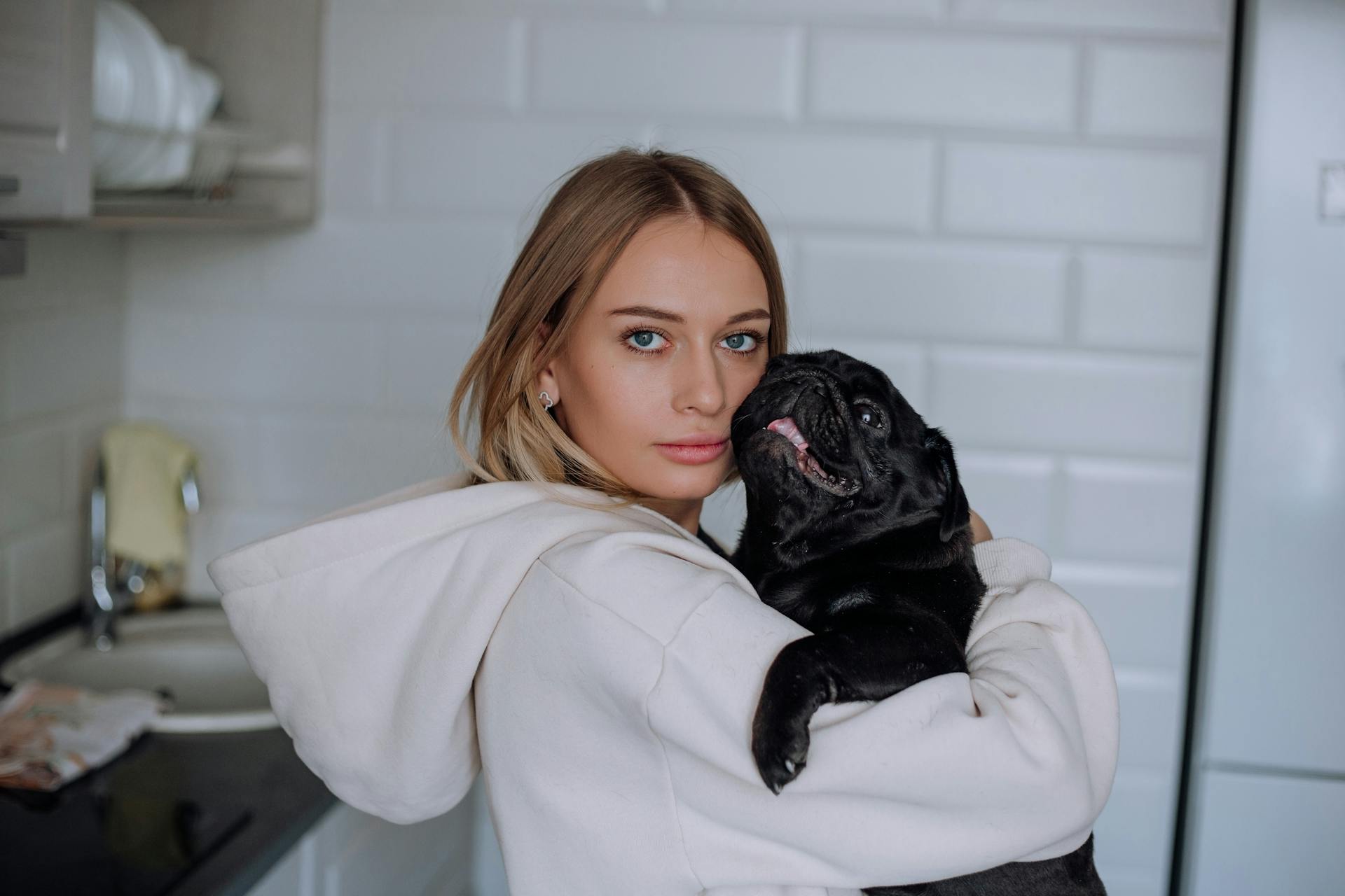 Young Woman Holding a Pug