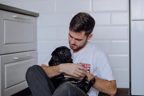 Free A Man Petting His Dog Stock Photo